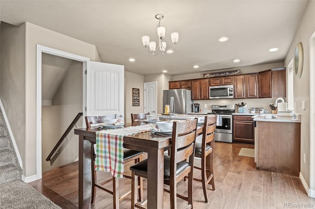 9840 Castor Dr, Colorado Springs, CO 80925 - interior space with baseboards, wood finished floors, a chandelier, and recessed lighting
