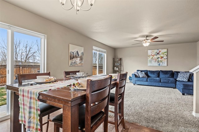 9840 Castor Dr, Colorado Springs, CO 80925 - dining area with ceiling fan with notable chandelier and carpet