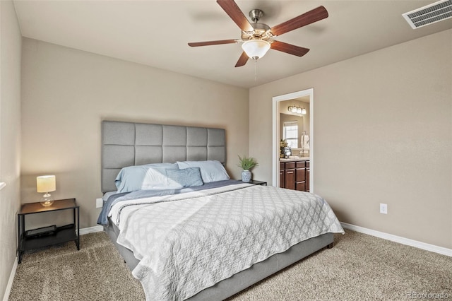 9840 Castor Dr, Colorado Springs, CO 80925 - carpeted bedroom with a ceiling fan, connected bathroom, baseboards, and visible vents
