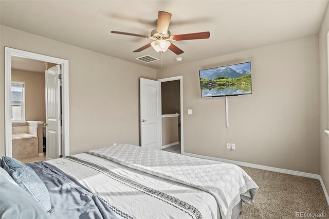 9840 Castor Dr, Colorado Springs, CO 80925 - bedroom featuring baseboards, carpet floors, ensuite bath, ceiling fan, and visible vents