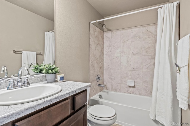 9840 Castor Dr, Colorado Springs, CO 80925 - full bath with toilet, vanity, a textured wall, and shower / tub combo