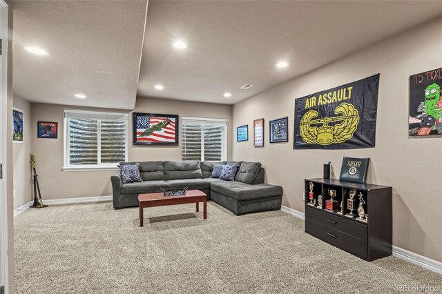 9840 Castor Dr, Colorado Springs, CO 80925 - living area featuring carpet flooring, baseboards, and recessed lighting