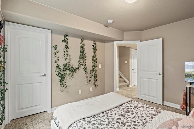 9840 Castor Dr, Colorado Springs, CO 80925 - bedroom with baseboards and light colored carpet