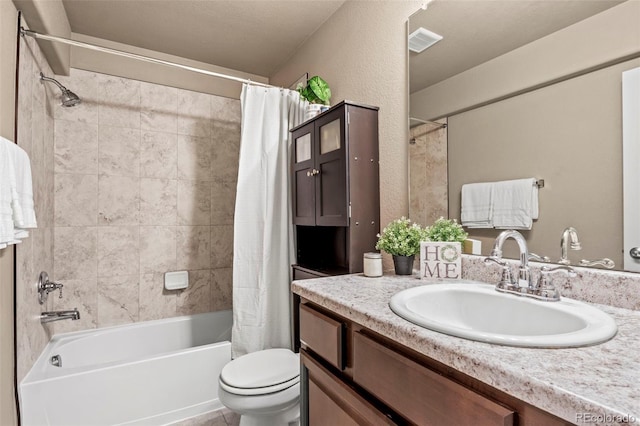 9840 Castor Dr, Colorado Springs, CO 80925 - bathroom with shower / bath combo with shower curtain, visible vents, toilet, and vanity