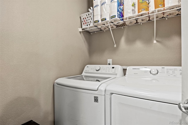 9840 Castor Dr, Colorado Springs, CO 80925 - laundry room with a textured wall, washer and dryer, and laundry area