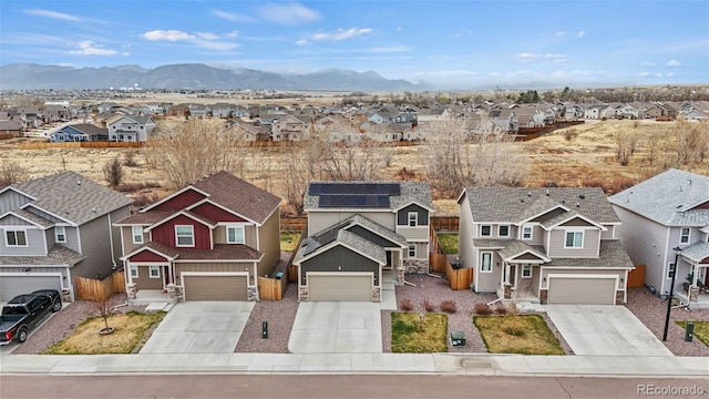 9840 Castor Dr, Colorado Springs, CO 80925 - view of front of property with stone siding, concrete driveway, and a residential view