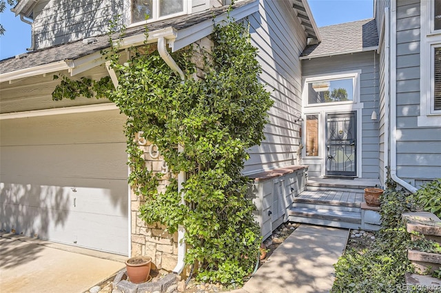 view of exterior entry featuring a garage