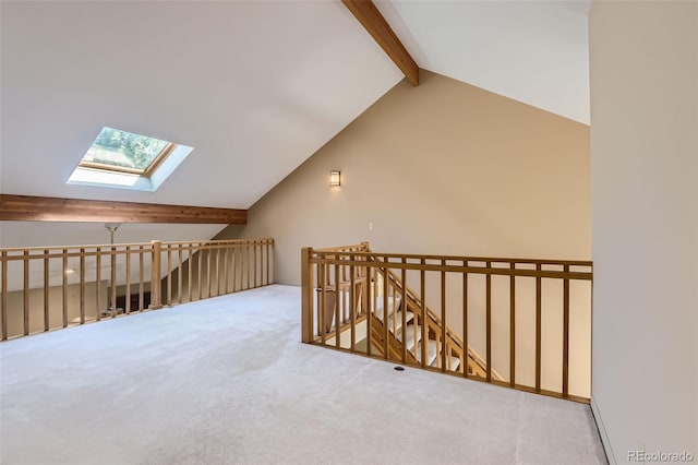 additional living space with vaulted ceiling with skylight and carpet floors