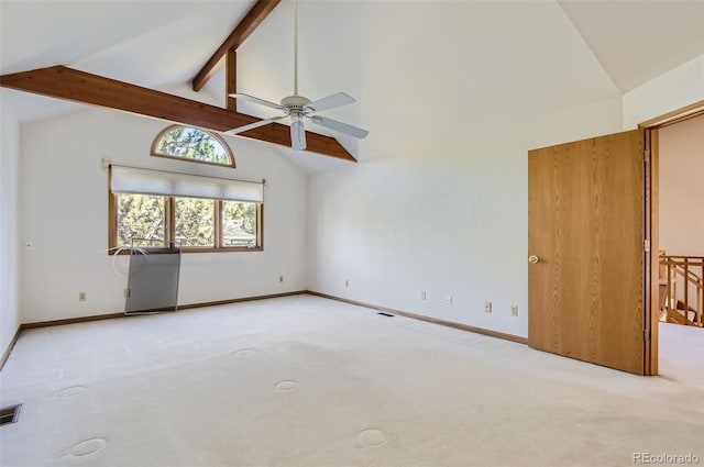 unfurnished room featuring ceiling fan, beamed ceiling, light carpet, and high vaulted ceiling