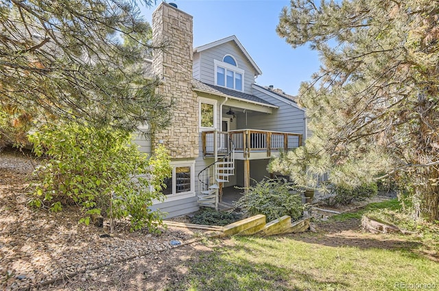 rear view of house with a wooden deck