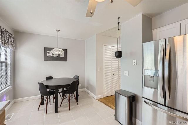 8136 Washington St Unit 141, Denver, CO 80229 - dining space with baseboards and light tile patterned flooring