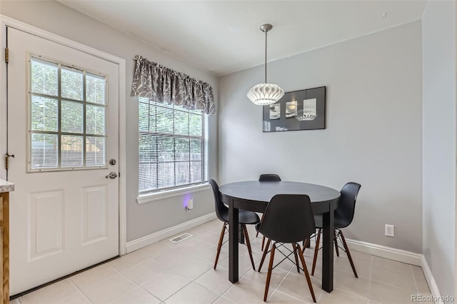 8136 Washington St Unit 141, Denver, CO 80229 - dining space featuring plenty of natural light, baseboards, and light tile patterned flooring
