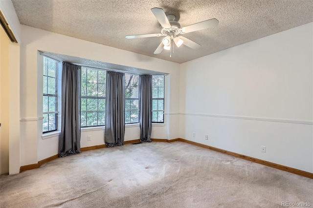 8136 Washington St Unit 141, Denver, CO 80229 - carpeted spare room with healthy amount of natural light, ceiling fan, baseboards, and a textured ceiling