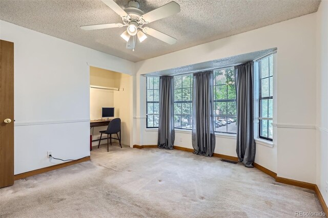 8136 Washington St Unit 141, Denver, CO 80229 - home office featuring carpet flooring, a textured ceiling, baseboards, and ceiling fan
