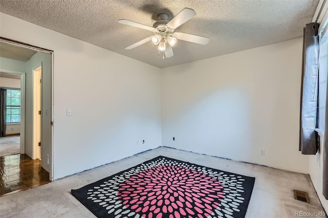 8136 Washington St Unit 141, Denver, CO 80229 - carpeted empty room featuring ceiling fan and a textured ceiling