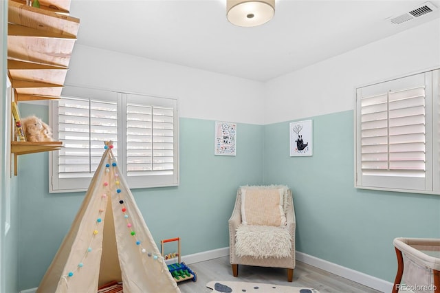 recreation room featuring light wood-type flooring