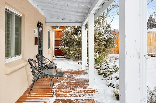 view of snow covered deck