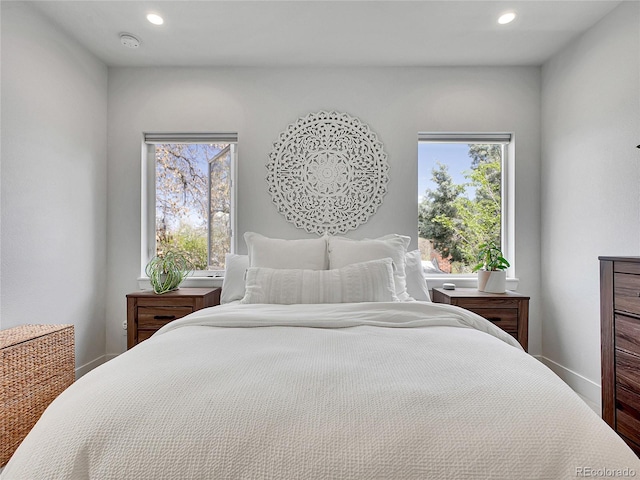 1303 Jersey St, Denver, CO 80220 - bedroom with recessed lighting, multiple windows, baseboards, and wood finished floors