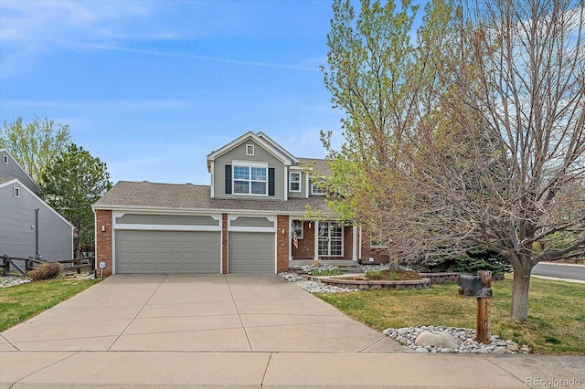 traditional-style home with driveway, brick siding, a front lawn, and an attached garage