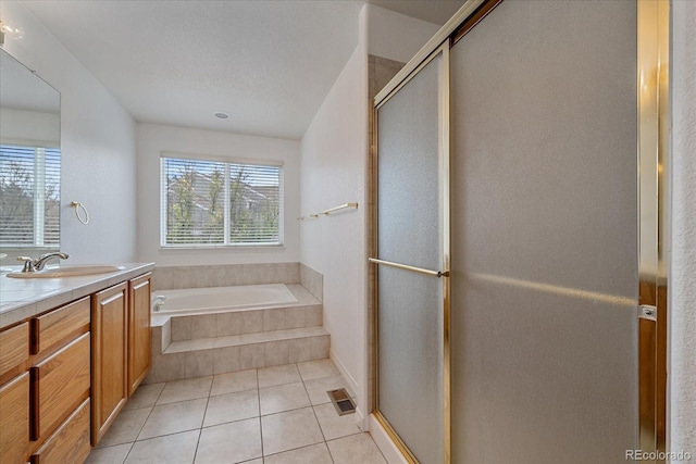 full bath featuring a bath, visible vents, tile patterned flooring, a shower stall, and vanity
