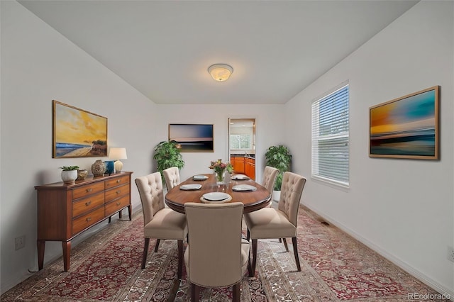 dining room featuring baseboards