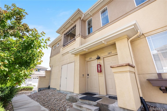 847 E 98th Ave Unit 1806, Thornton, CO 80229 - doorway to property with stucco siding
