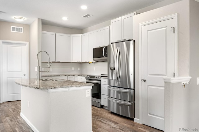 847 E 98th Ave Unit 1806, Thornton, CO 80229 - kitchen with appliances with stainless steel finishes, a sink, light wood-style floors, light stone countertops, and recessed lighting