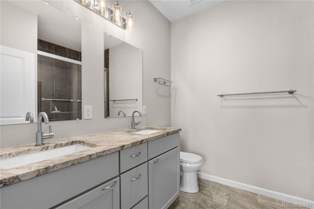 847 E 98th Ave Unit 1806, Thornton, CO 80229 - bathroom featuring double vanity, toilet, baseboards, and tiled shower