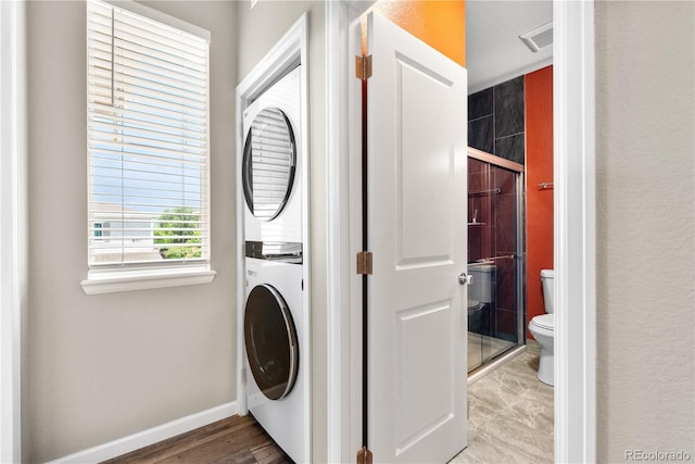 847 E 98th Ave Unit 1806, Thornton, CO 80229 - laundry room with stacked washing machine and dryer and baseboards