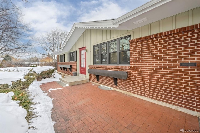 view of snow covered patio