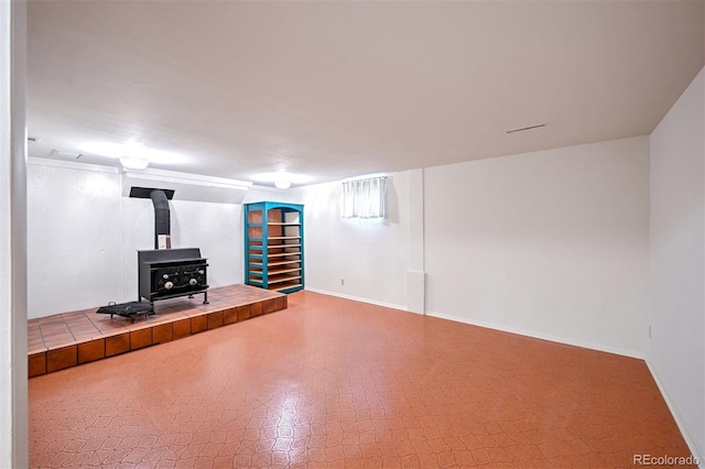 basement featuring a wood stove