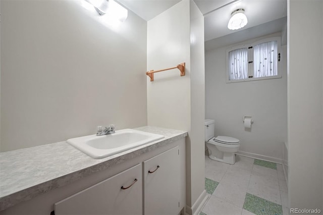 bathroom with vanity and toilet