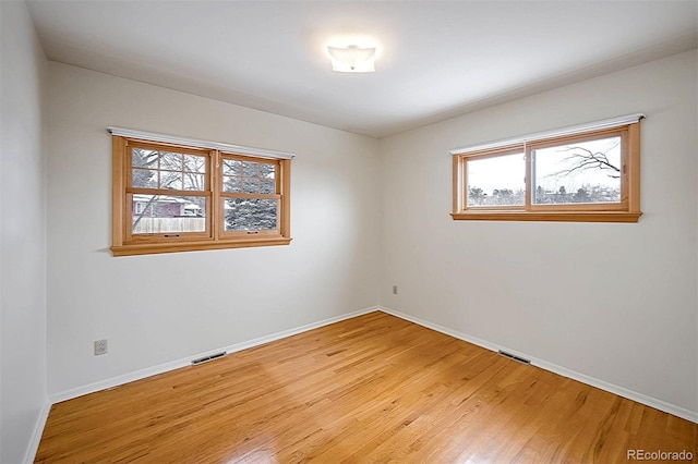 empty room featuring hardwood / wood-style flooring