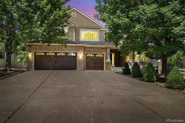 3901 Stonegrass Pt, Broomfield, CO 80023 - view of front of house featuring brick siding, driveway, and a garage
