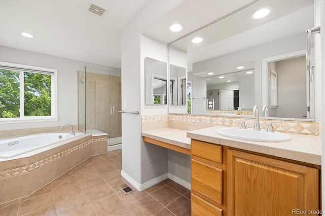 3901 Stonegrass Pt, Broomfield, CO 80023 - full bath featuring a garden tub, vanity, decorative backsplash, a shower stall, and recessed lighting