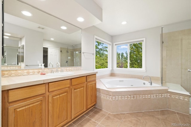 3901 Stonegrass Pt, Broomfield, CO 80023 - bathroom featuring a tub with jets, vanity, a stall shower, recessed lighting, and tile patterned flooring