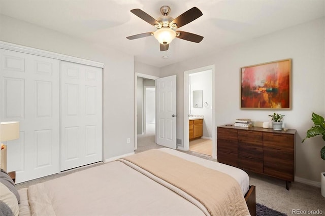3901 Stonegrass Pt, Broomfield, CO 80023 - bedroom featuring light colored carpet, a closet, ceiling fan, and ensuite bath
