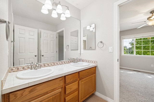 3901 Stonegrass Pt, Broomfield, CO 80023 - full bath featuring double vanity, ceiling fan, and a chandelier