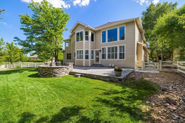 3901 Stonegrass Pt, Broomfield, CO 80023 - back of house with a patio and a fenced backyard