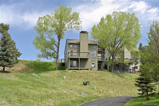 23846 Genesee Village Rd, Golden, CO 80401 - rear view of house with a chimney