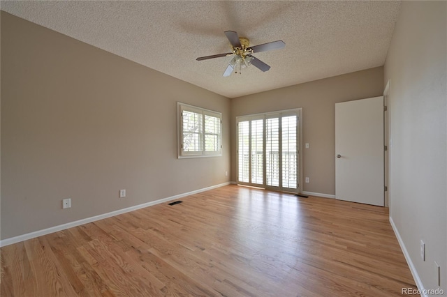 23846 Genesee Village Rd, Golden, CO 80401 - spare room featuring a ceiling fan, a textured ceiling, light wood finished floors, and baseboards