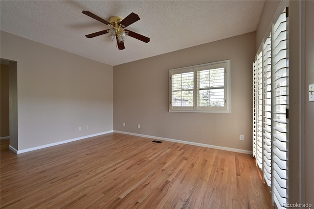 23846 Genesee Village Rd, Golden, CO 80401 - unfurnished room with ceiling fan, light wood-style floors, a textured ceiling, and baseboards