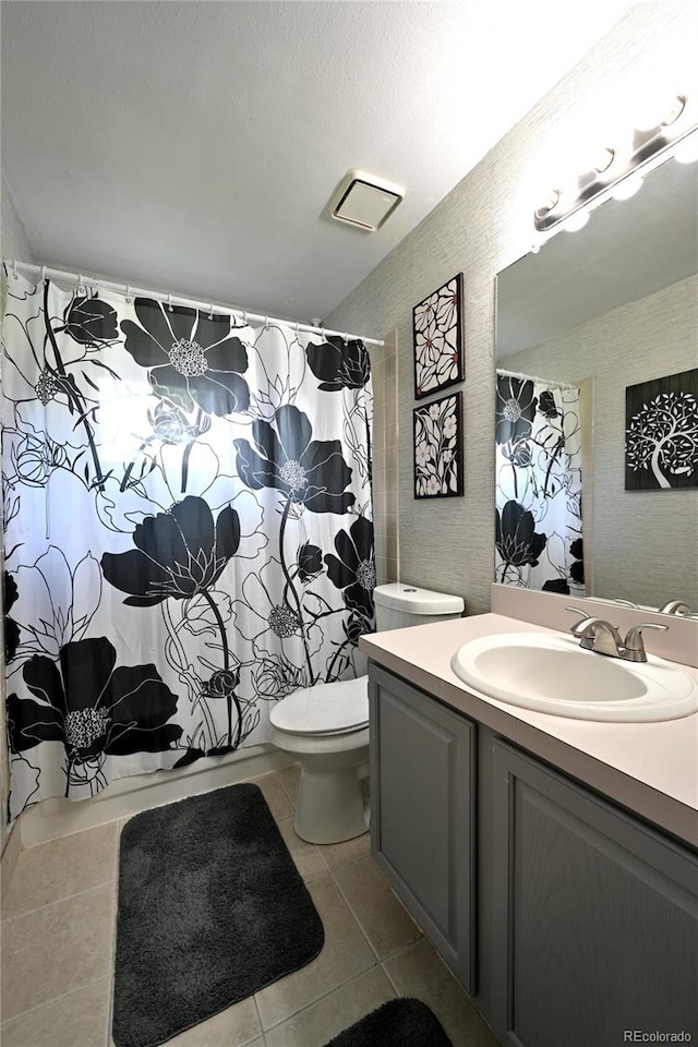 23846 Genesee Village Rd, Golden, CO 80401 - bathroom featuring tile patterned flooring, toilet, and vanity
