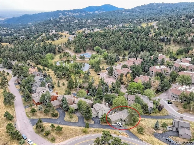 23846 Genesee Village Rd, Golden, CO 80401 - aerial view of residential area featuring mountains and a forest