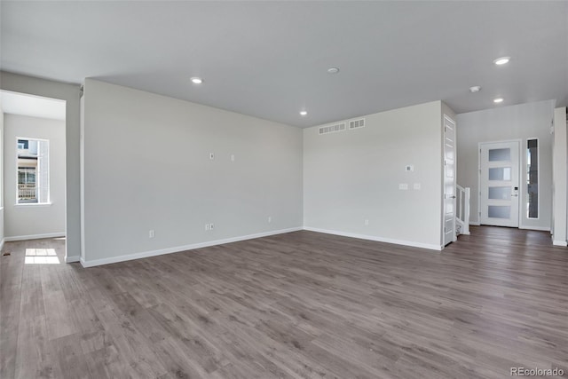 unfurnished living room with hardwood / wood-style floors