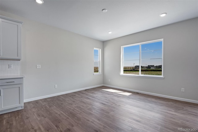 spare room featuring light wood-type flooring