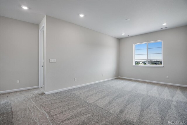 spare room featuring carpet floors