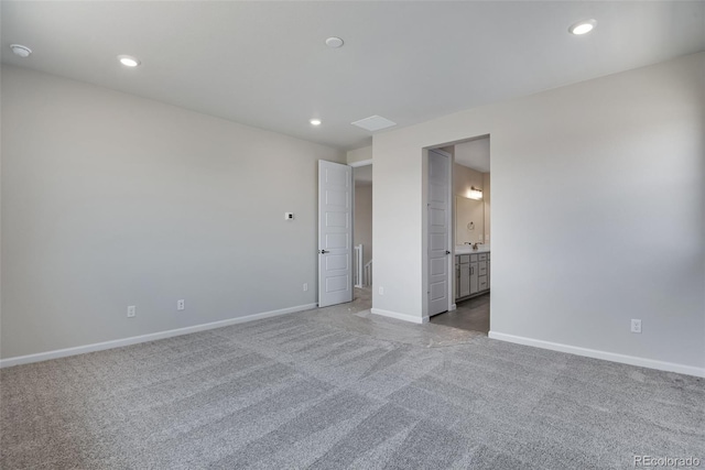 unfurnished bedroom with recessed lighting, carpet, and baseboards