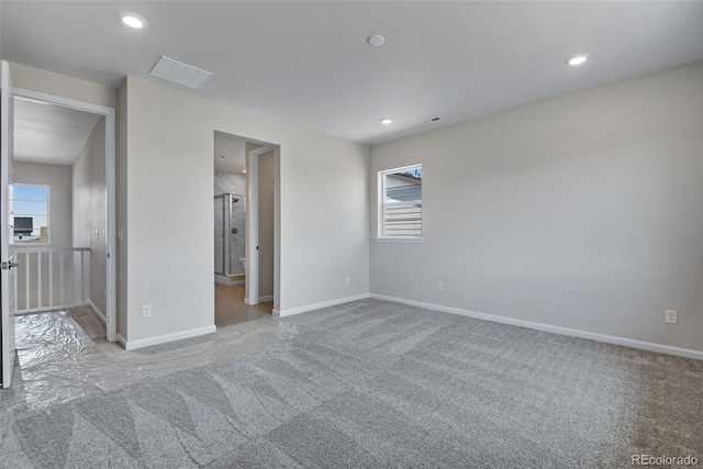 unfurnished bedroom featuring recessed lighting, baseboards, and carpet flooring