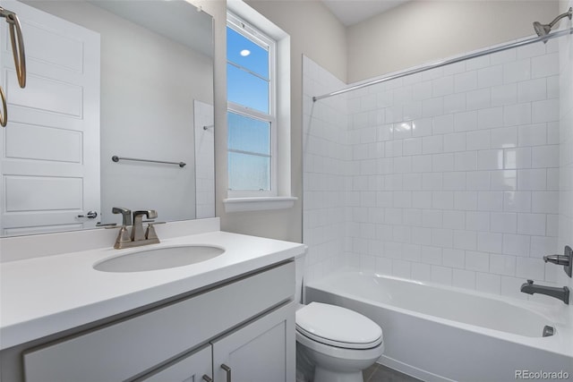 full bathroom featuring tub / shower combination, toilet, and vanity